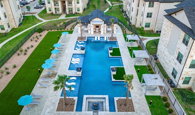 Resort-style swimming pool with lounge seating