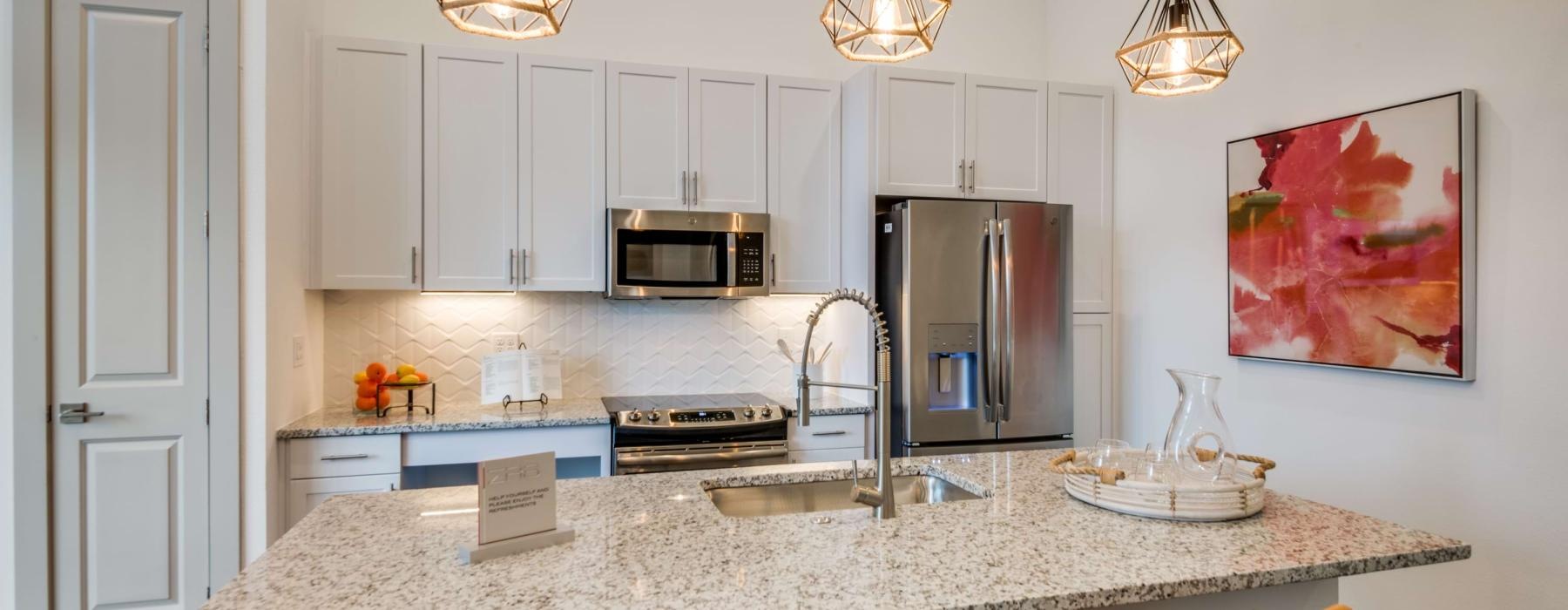 a kitchen with a marble countertop